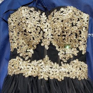 Black and gold strapless gown